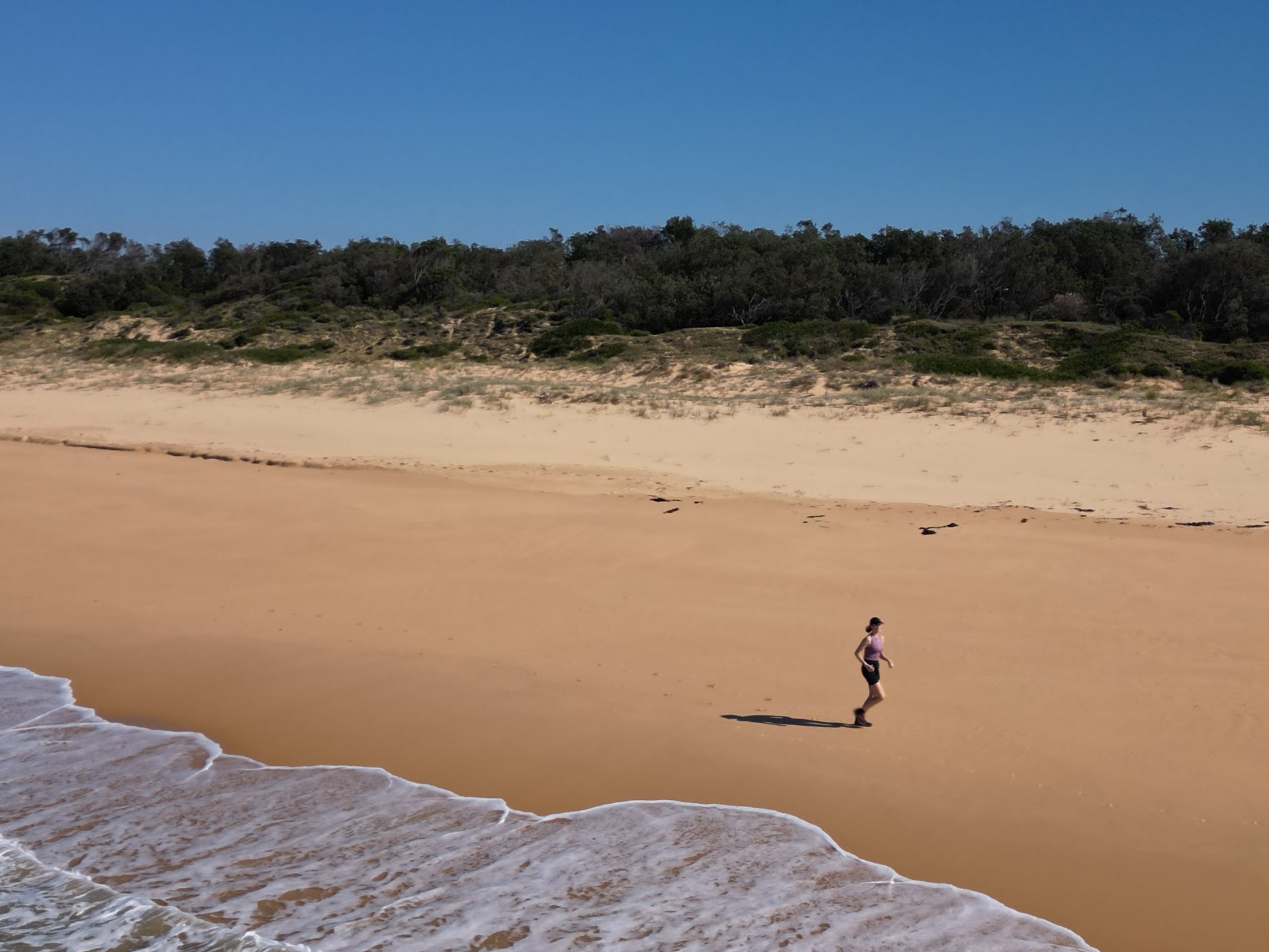 Kat running along Hobart Beach