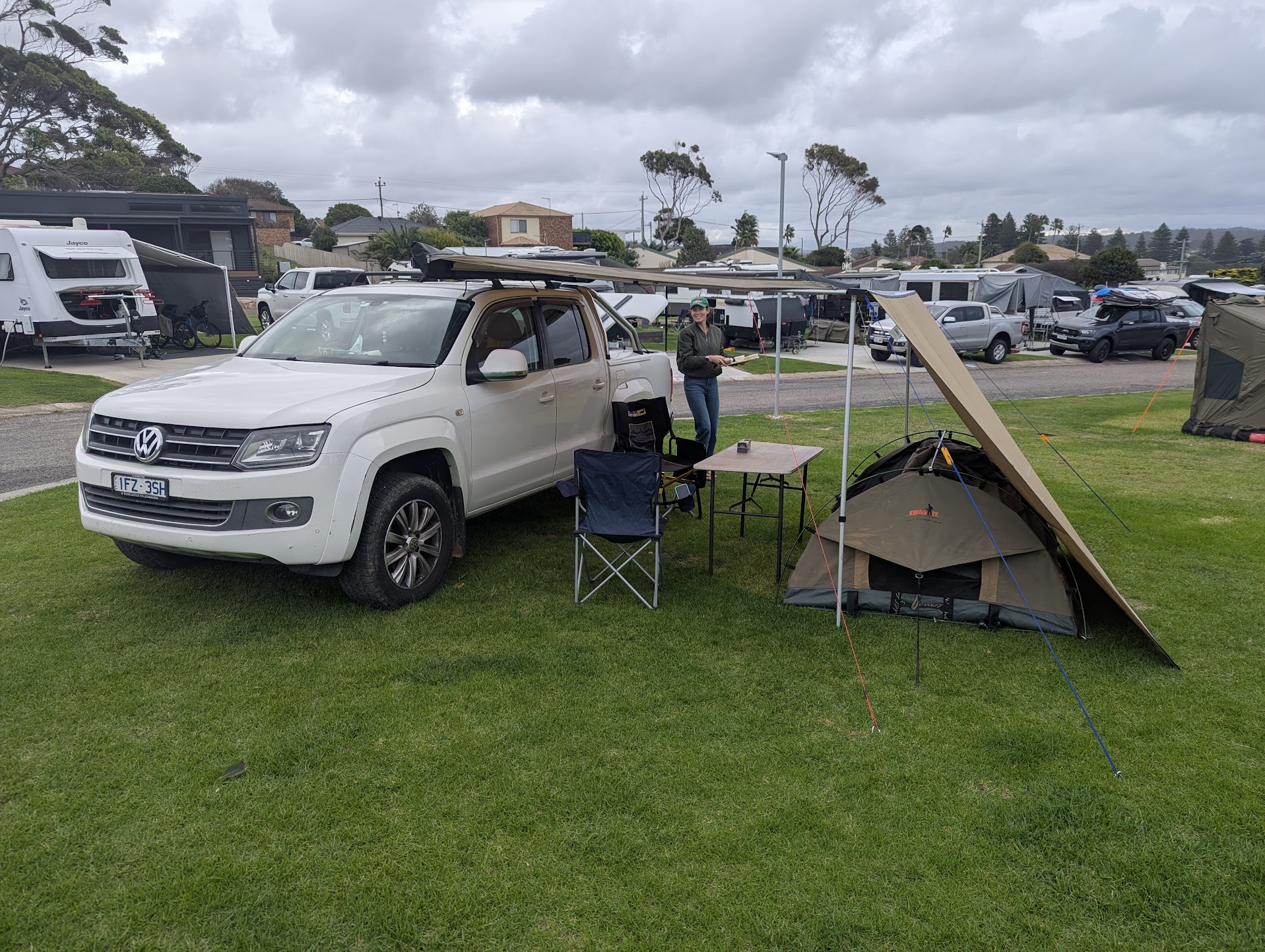 Our camp setup with the Amarok at Reflections Bermagui, with Kat preparing a cheeseboard for two featuring Tilba Dairy Products.